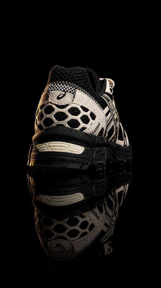 ASICS Gel-Kahana 8 'Black Cream' photographed on black with reflection